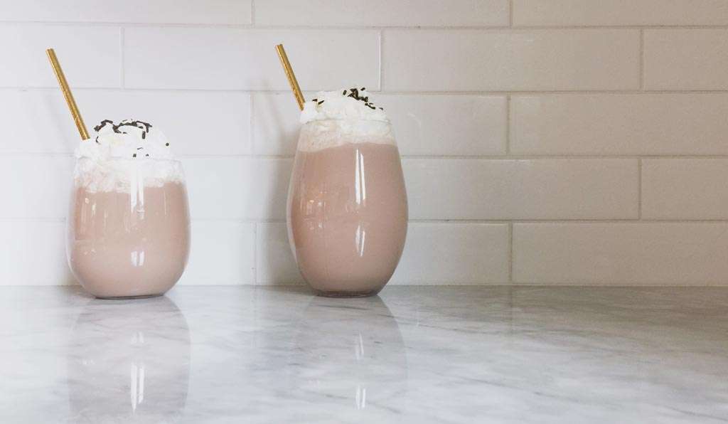 hot chocolate float drink in glass with straw