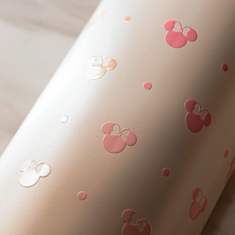 Close-up of a pink zak water bottle with small minnie mouse icons